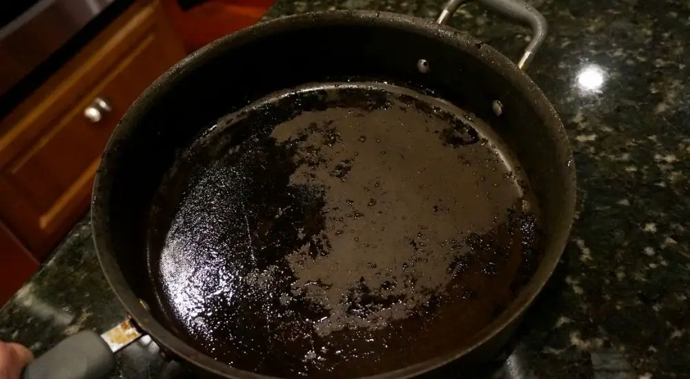remove burnt sugar from non stick pan